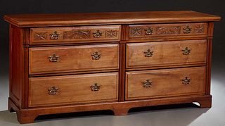 French Provincial Carved Cherry Sideboard, 20th c., the ogee edge rectangular top over two frieze drawers above four deep drawers, flanked by reeded p