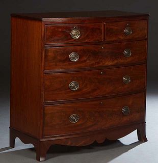 English Georgian Style Carved Mahogany Bowfront Chest, 19th c., the stepped top over two frieze drawers above three deep drawers, on a plinth base on 
