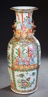 Large Chinese Famille Rose Porcelain Baluster Vase, 19th c., the everted rim over a tapering neck with applied Foo dogs and salamanders, above reserve