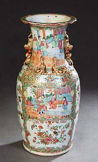 Chinese Famille Rose Porcelain Baluster Vase, 19th c., the everted rim over applied Foo dogs and salamanders above reserves of interior scenes, birds 