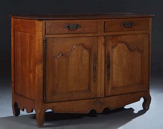French Provincial Louis XV Style Carved Cherry Sideboard, 19th c., the canted corner two board top over two frieze drawers above double cupboard doors