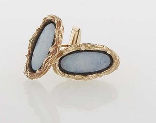 Pair of 14K Yellow Gold Opal Cufflinks, with an oval opal slab within a black enamel border, and a relief branch form border, H.- 1 1/8 in., W.- 5/8 i