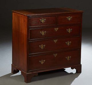 English Carved Mahogany Georgian Style Chest, 19th c., the rounded edge top over two frieze drawers and three graduated deep drawers, on a plinth base