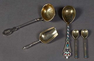 Five Pieces of Russian Sterling, 19th c., consisting of a handled gilt tea strainer, 1889, Moscow, by Ivan Khlebnikov, with an assay mark for Lev Olek
