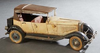 French Polychromed Tin Toy Touring Car, early 20th c., H.- 6 1/4 in., W.- 5 3/4 in., D.- 15 1/2 in. Provenance: British Antiques, Magazine St., New Or