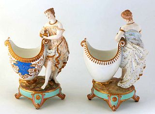 Pair of German Porcelain Figural Garniture Vases, late 19th c., with classicaly draped women standing on the side of the egg shaped vase, with blue an