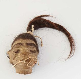Animal Hide Replica of a Shrunken Head, with hair, 20th c., H.- 3 1/2 in., W.- 2 1/4 in., D.- 2 1/4 in.