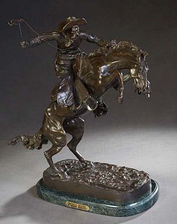 After Frederic Remington, "The Bronco Buster," 20th/21st c., patinated bronze figural group, on an ogee edge verde antico marble base, with a brass na