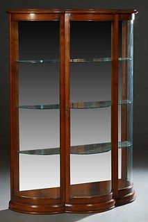 French Louis Philippe Style Carved Cherry Vitrine, 20th c., the stepped serpentine top over a center door with a wide beveled curved glass flanked by 