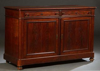 French Provincial Carved Walnut Louis Philippe Sideboard, 19th c., the rounded edge and corner top over two frieze drawers, above double cupboard door