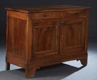 French Provincial Louis Philippe Carved Walnut Sideboard, 19th c., the rectangular top over two frieze drawers above double cupboard doors, on a plint