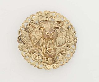 14K Yellow Gold Circular Repousse Tiger Brooch, 20th c., the repousse tiger head centering a circular pierced scroll decorated back plate, H.- 1 in., 