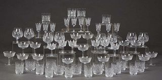 Set of Fifty-Nine Pieces of Waterford Crystal, consisting of 16 champagne glasses, 10 Sherry glasses, 6 red wine glasses, 12 rocks glasses, 7 juice gl