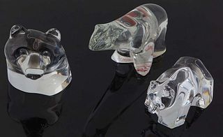 Group of Three Baccarat Crystal Bear Paperweights, 20th c., of a polar bear, a bear head, and a bear on his feet, each signed with an acid stamp, Pola