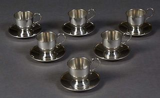 Twelve Piece Cartier Sterling Demitasse set, 20th c., # 601, consisting of six cup holders, lacking the porcelain liners, and six matching saucers, Cu