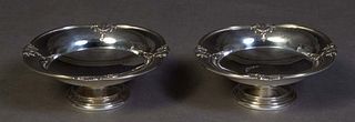 Pair of Elkington Sterling Candy Dishes, Birmingham, 1938, #28979, the oval pierced rim with relief floral garland decoration, on a stepped footed bas