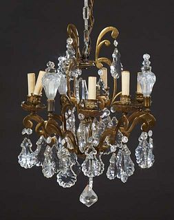 Louis XV Style Gilt Bronze Six Light Chandelier, early 20th c., the six candle arms flanked by three mounted crystal spires, H.- 19 in., Dia.- 18 in.