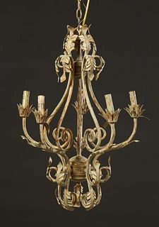 French Gilt Tole Four Light Chandelier, 20th c., the leaf form top issuing four scrolled arms with sockets, over a leaf form bottom, H.- 28 in., Dia.-