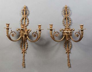Pair of French Bronze Louis XVI Style Three Light Sconces, 20th c., with pierced wreath mounted back plates issuing three scrolled arms with brass bob