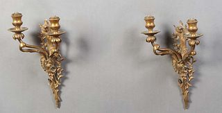 Pair of Louis XV Style Bronze Two Light Sconces, early 20th c., with a pierced scroll and branch back plate issuing two scrolled arms, wired, H.- 10 1