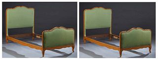 Pair of French Louis XV Style Carved Cherry Sleigh Beds, 20th c., the upholstered curved head and foot boards, joined by wooden rails, in green velvet