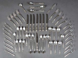 Sixty-One Piece Set of English Sterling Flatware, Sheffield, 1914, consisting of 7 seafood cocktail forks, 8 teaspoons, 8 cream soup spoons, 8 salad f