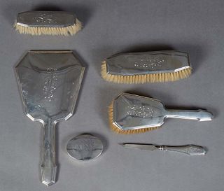 Six Sterling Pieces, 20th c., consisting of a five piece dresser set by Foster and Bailey, Rhode Island, #5915, consisting of a hand mirror, a hairbru