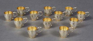 Jean Elysee Puiforcat (1897-1945, French), Set of Twelve Gilt First Standard Silver Liqueur Cups, with engraved decoration and a monogram, together wi