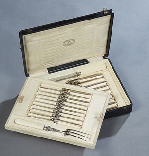 Cased Set of Ivory Handled Cutlery, 19th c., by Jules Picaault, Paris, consisting of two liftout fitted trays, one with 18 fruit knives and a carving 