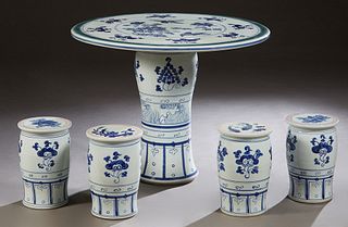 Chinese Porcelain Five Piece Patio Set, 20th c., consisting of a circular table and four blue and white cylindrical stools, H.- 27 1/2 in., Dia.- 34 1
