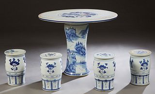 Chinese Five Piece Porcelain Patio Set, 20th c., consisting of a circular table with bird and floral decoration, and four cylindrical stools, H.- 28 i