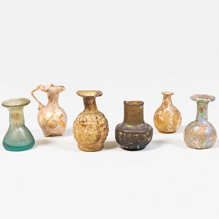 Group of Five Small Roman Glass Vessels together with a Double-Sided Janus Jar