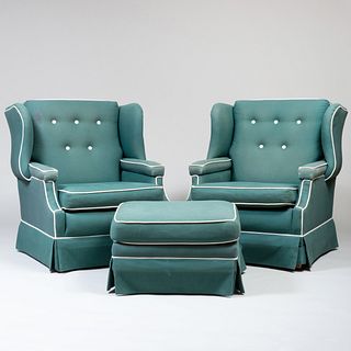 Pair of Upholstered Wing Chairs with Piping and a Matching Ottoman