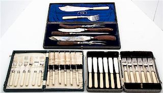 A Group of Silver-Plate and Faux Ivory Handled Flatware Length of longest server 14 3/8 inches