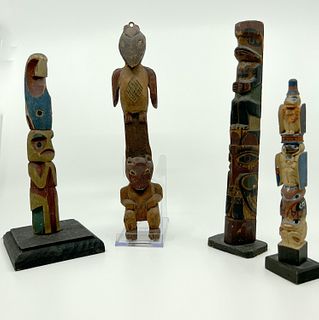 Four Vintage Northwest Totem Poles
