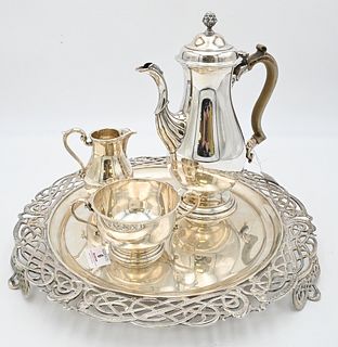 Four Piece Silver Set, to include teapot, sugar, creamer, and round tray, diameter of tray 15 1/4 inches, 102.7 t.oz. Provenance: Collections of Norma