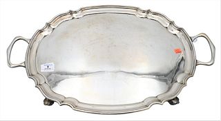 Silver Two Handle Tray, on scrolled feet, total length 24 1/2 inches, 81.4 t.oz. Provenance: Collections of Norma Reilly, New Jersey.