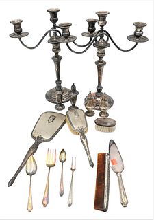 Sterling Silver Lot, to include a pair of sterling silver candelabras; brush, and mirror, weighted; four shakers; flatware; height 15 inches.