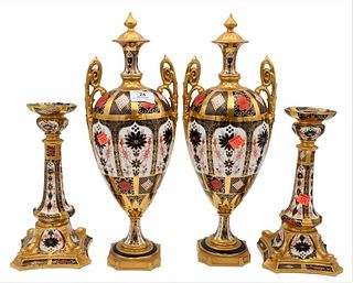 Four Piece Lot of Royal Crown Derby, to include a pair of urns, and a pair of candlesticks, (one urn with small crack to top finial, one corner missin