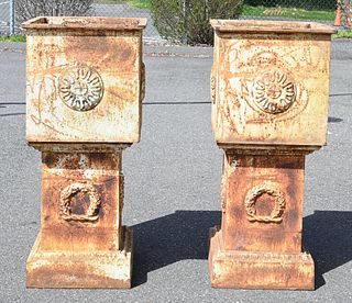 Pair of Square Iron Urns on Pedestals, height 44 inches, top 19 1/2" x 19 1/2".