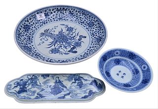 Three Blue and White Chinese Porcelain Pieces, to include a large charger with scrolling leaves, diameter 14 1/4 inches; an oblong plaque having moral