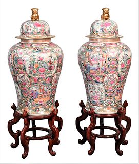 Pair of Famille Rose Monumental Palace Urns, each with fitted stands, height 45 inches. Provenance: Collections of Norma Reilly, New Jersey.