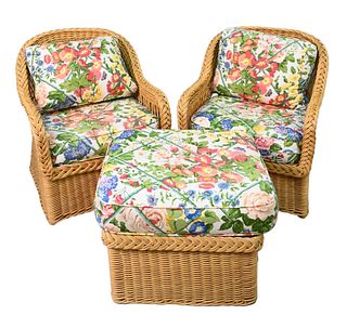 Bielecky Brothers Three Piece Wicker Set, to include two armchairs and ottoman, along with custom cushions, height 32 inches, width 29 inches.
