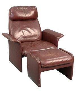 Designers Furniture Brown Leather Chair and Ottoman, (some wear), height 38 inches, width 37 inches.