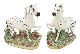 Pair of English Staffordshire Zebra Figures, height 7 1/4 inches, length 7 1/2 inches.