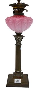 Victorian Oil Lamp, having candlestick base with pink cased glass well, made into a table lamp, height 33 inches. Provenance: Estate of Florence Yanni