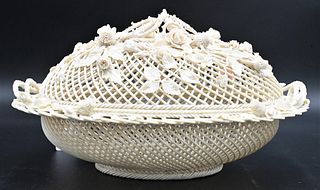 Large Oval Belleek Covered Basket, four strand, having reticulated cover and base with flower and leaf design, stick handles, impressed mark on bottom