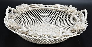 Belleek Porcelain Handled Basket, three strand, basket with flowers and twig handles, impressed mark on bottom, diameter 11 inches. Provenance: Collec