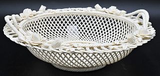 Belleek Porcelain Handled Basket, four strand, having flower and twig handles, Belleek Ireland impressed mark on bottom, diameter 11 inches. Provenanc
