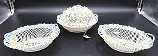 Group of Three Belleek Oval Basket, one with one cover encrusted with flowers along with a pair having twig handles, all four strand, largest 10 inche